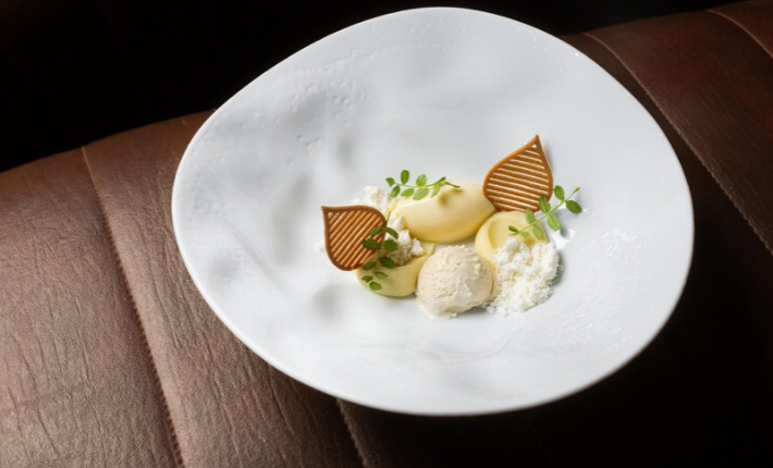 Dessert of white chocolate, olive oil, salted caramel ice cream - credits Nino Bouwers