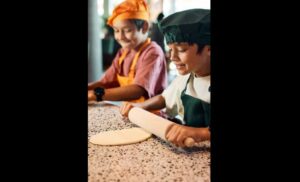 Learning how to bake pizza as a kid - DoubleTree by Hilton Amsterdam Central Station 