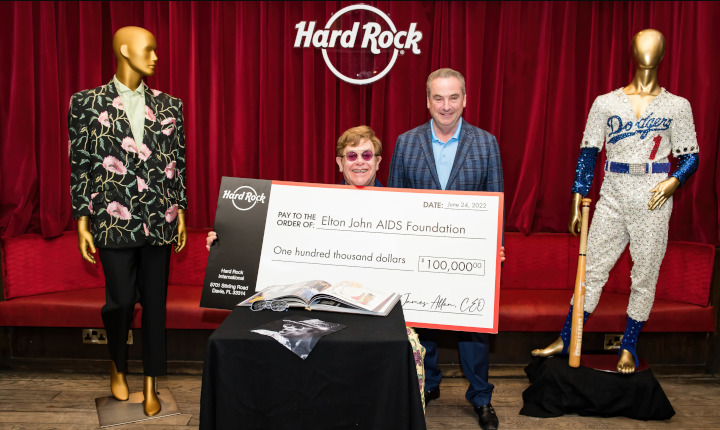 Hard Rock International presents Elton John with check for Elton John AIDS Foundation at London Hard Rock Cafe. Photo Credit: BEN GIBSON PHOTO